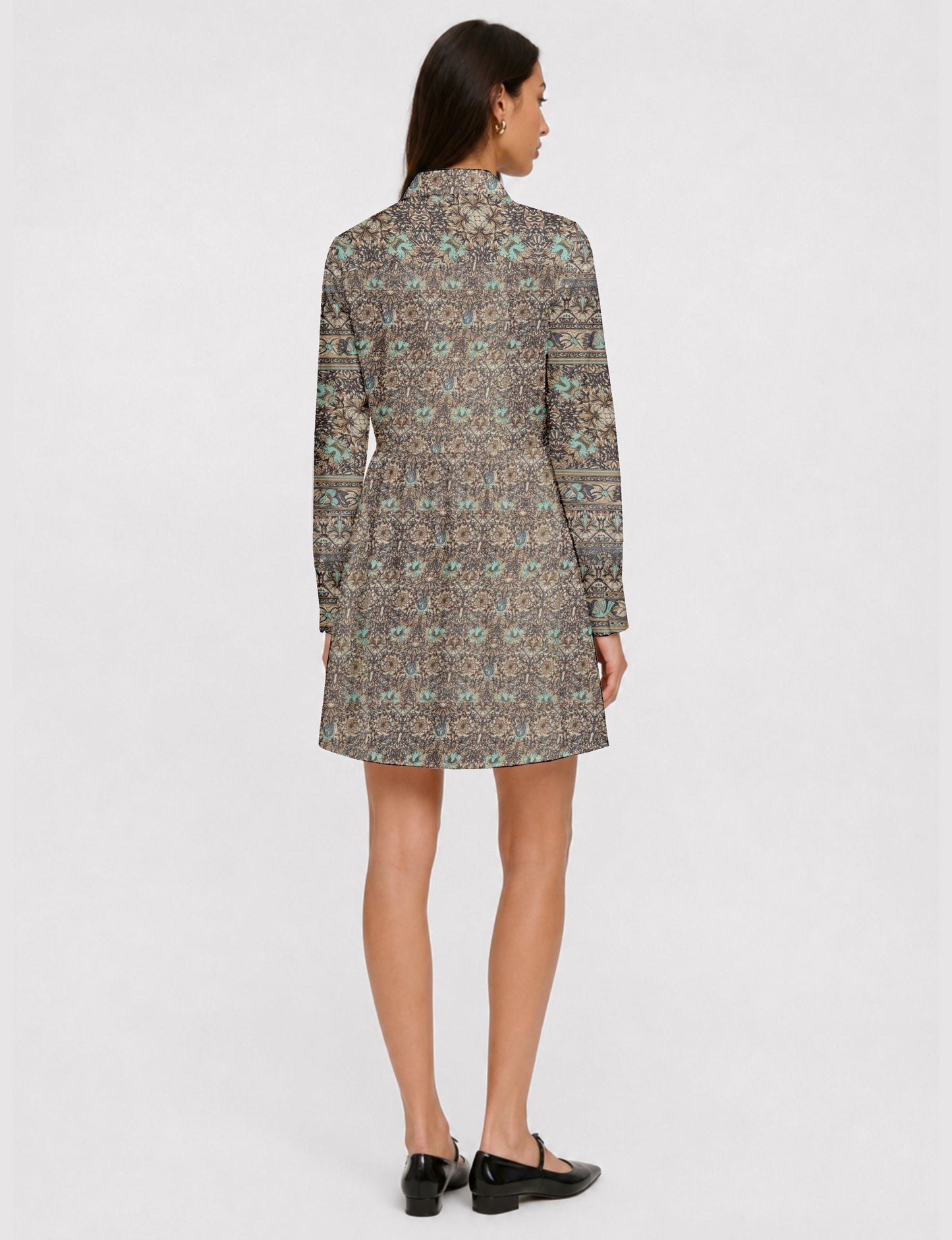 Short shirt dress with a relaxed A-line silhouette, point collar, partial button placket, gathered waist, side pockets, and full-length cuffed sleeves.
