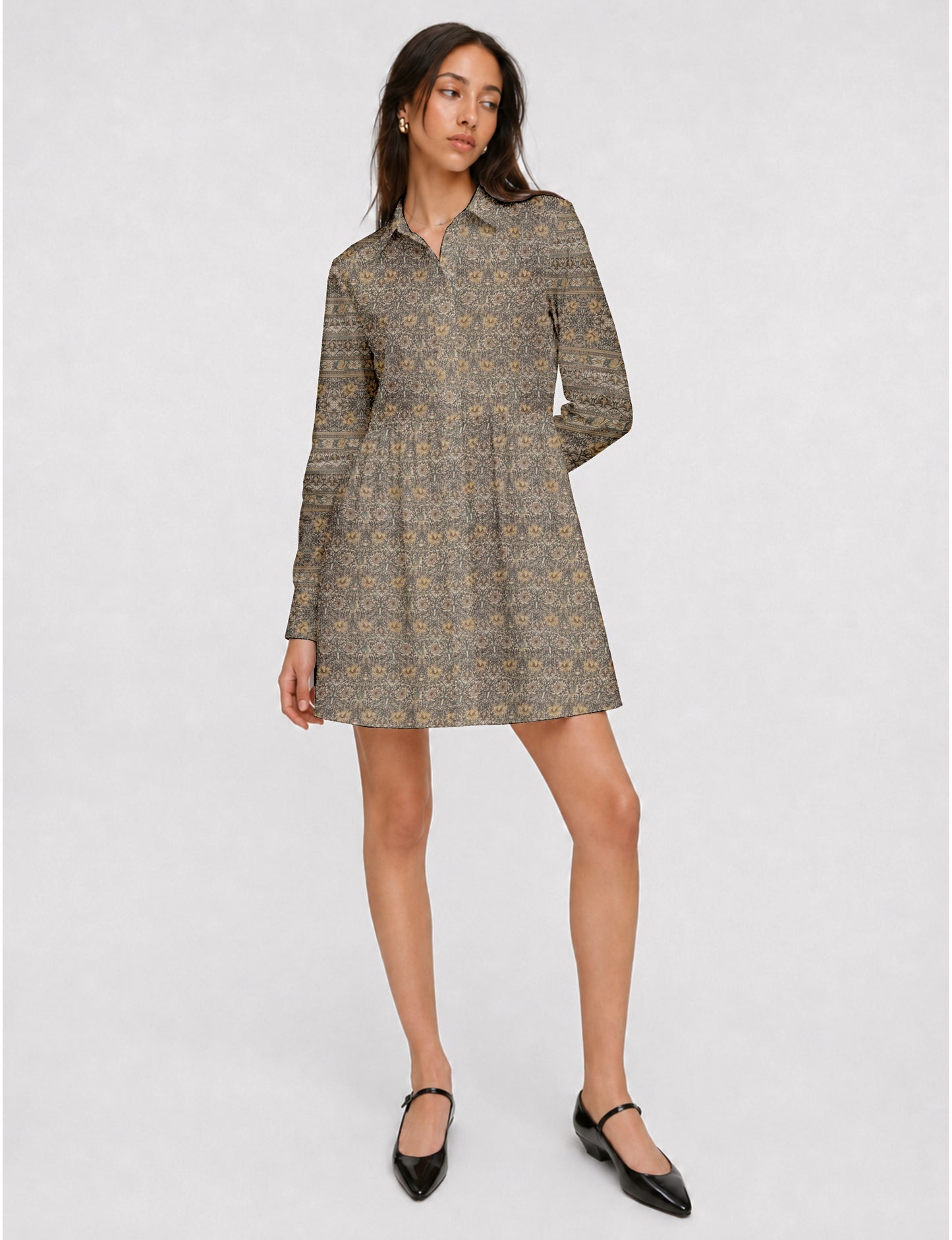 Short shirt dress with a relaxed A-line silhouette, point collar, partial button placket, gathered waist, side pockets, and full-length cuffed sleeves.
