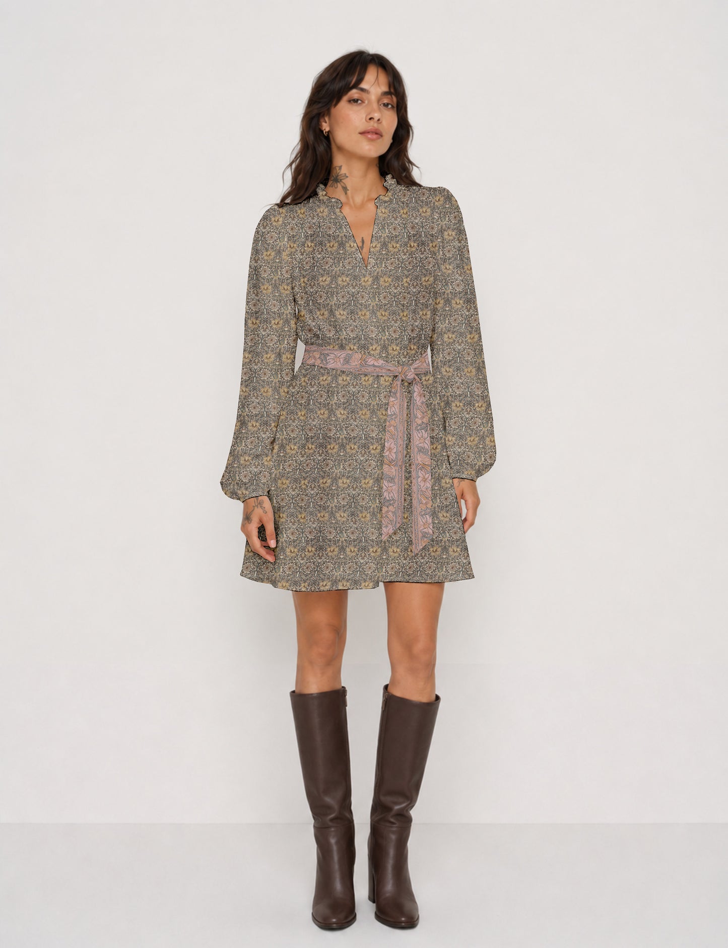 Swing dress with detachable tie belt, gathered ruffle neckline, full-length voluminous sleeves, elastic cuffs, and relaxed A-line silhouette in an above-knee length.