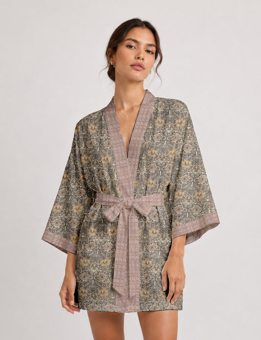 Short kimono robe with wrap front, V-neckline, wide sleeves, waist tie, and concealed skort detail.
