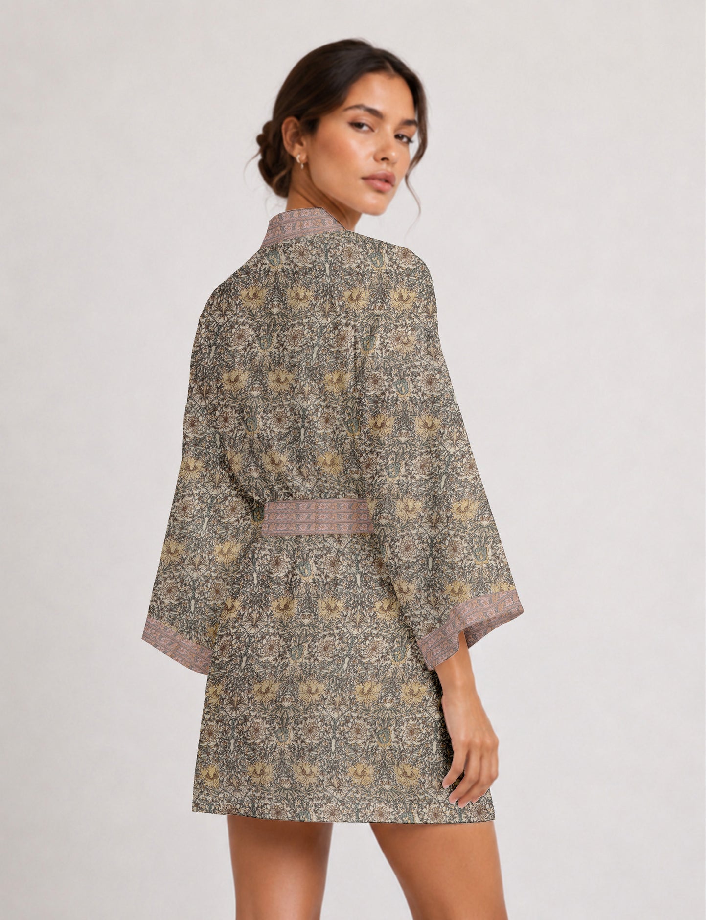 Short kimono robe with wrap front, V-neckline, wide sleeves, waist tie, and concealed skort detail.