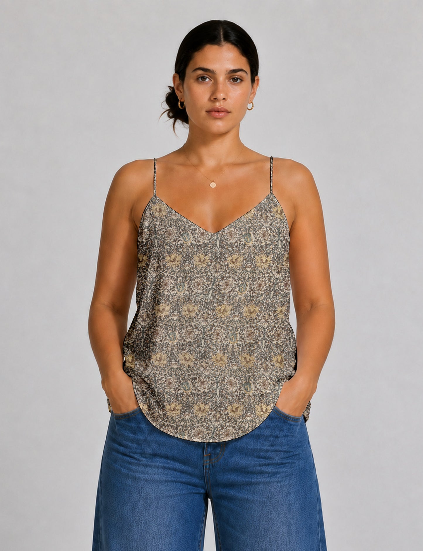 Women's sleeveless slip top with a relaxed straight fit, soft V-neckline, deep V-back, and delicate spaghetti straps.