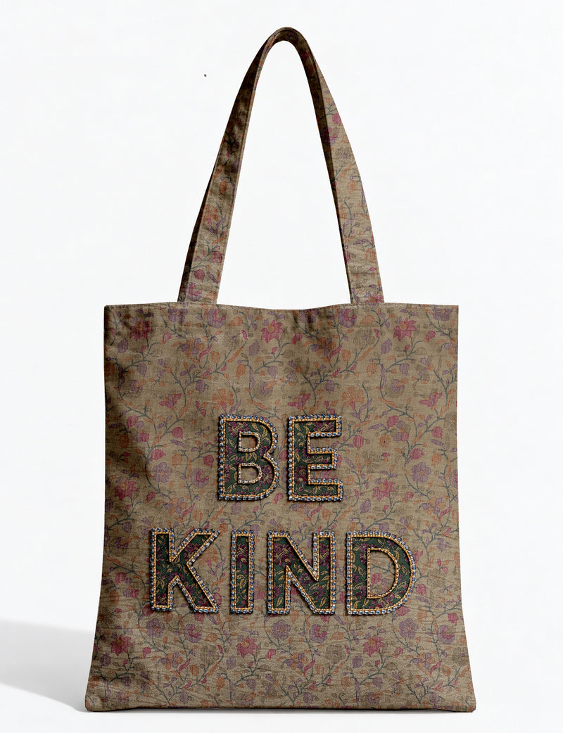 Be Kind tote bag with contrast sari fabric appliqué lettering, double shoulder straps, and front slip pocket.