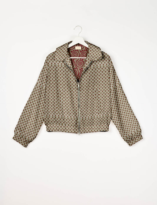 Upcycled Bomber Jacket made from recycled sari materials, featuring a cute cropped shape, elasticated hem and cuffs, and contrast sari print lining. Sustainable apparel promoting eco-friendly fashion and ethical clothing.