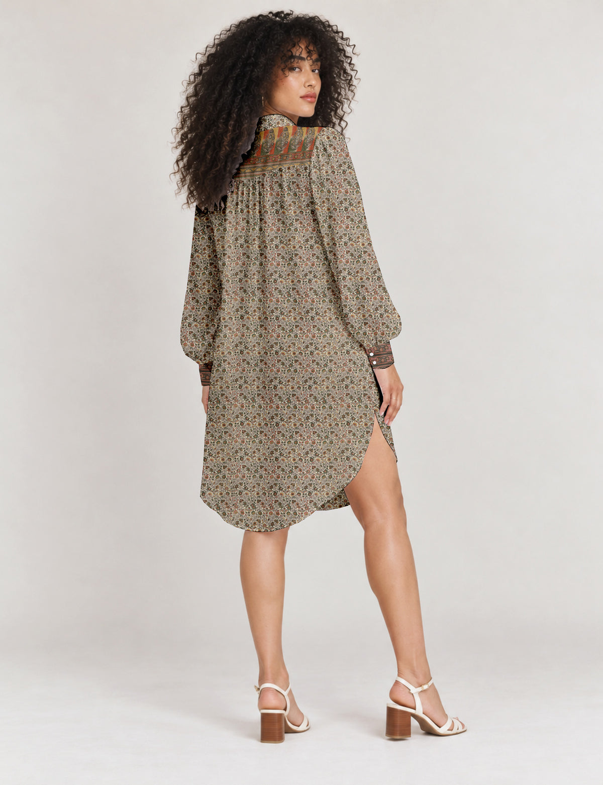 High low shirt with a relaxed fit, button-down front, classic collar, gathered shoulders and full-length blouson sleeves.