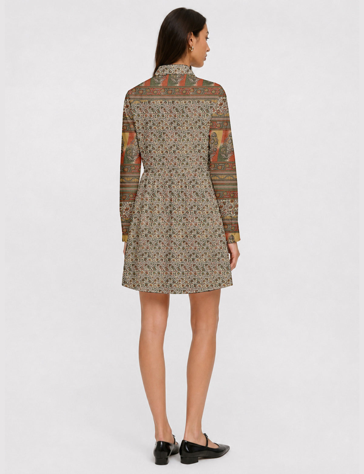 Short shirt dress with a relaxed A-line silhouette, point collar, partial button placket, gathered waist, side pockets, and full-length cuffed sleeves.