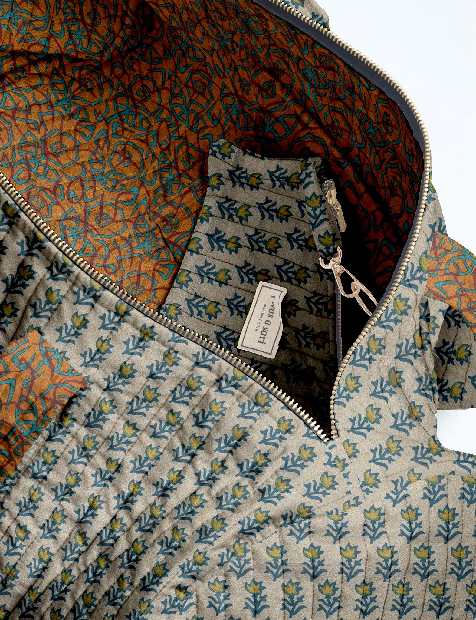 Brown paisley quilted bowling bag with dual handles, front zipper pocket, and "I was a sari" label on front side