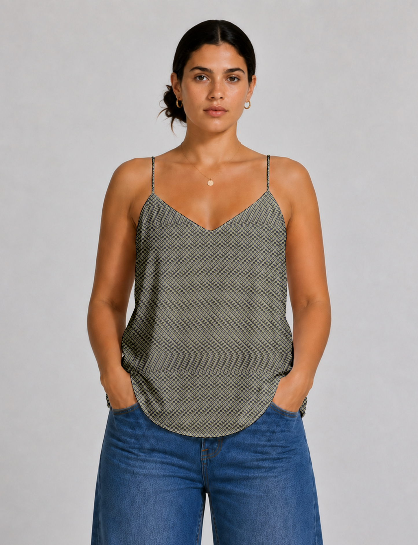 Women's sleeveless slip top with a relaxed straight fit, soft V-neckline, deep V-back, and delicate spaghetti straps.