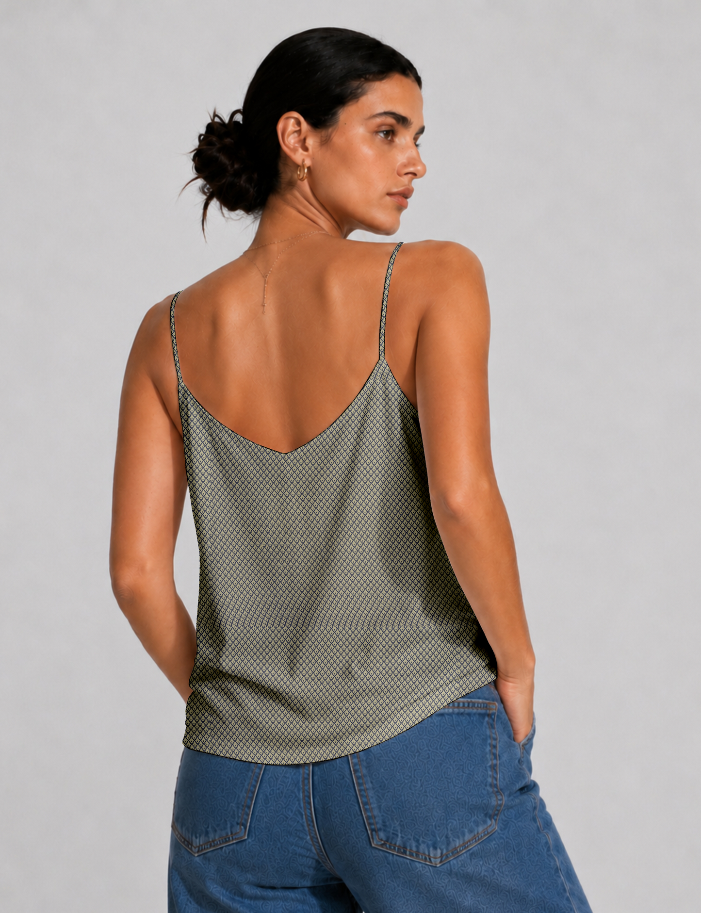 Women's sleeveless slip top with a relaxed straight fit, soft V-neckline, deep V-back, and delicate spaghetti straps.