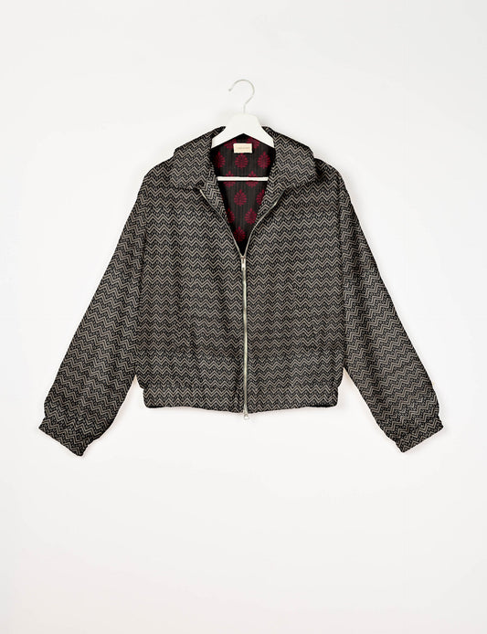 Upcycled Bomber Jacket made from recycled sari materials, featuring a cute cropped shape, elasticated hem and cuffs, and contrast sari print lining. Sustainable apparel promoting eco-friendly fashion and ethical clothing.