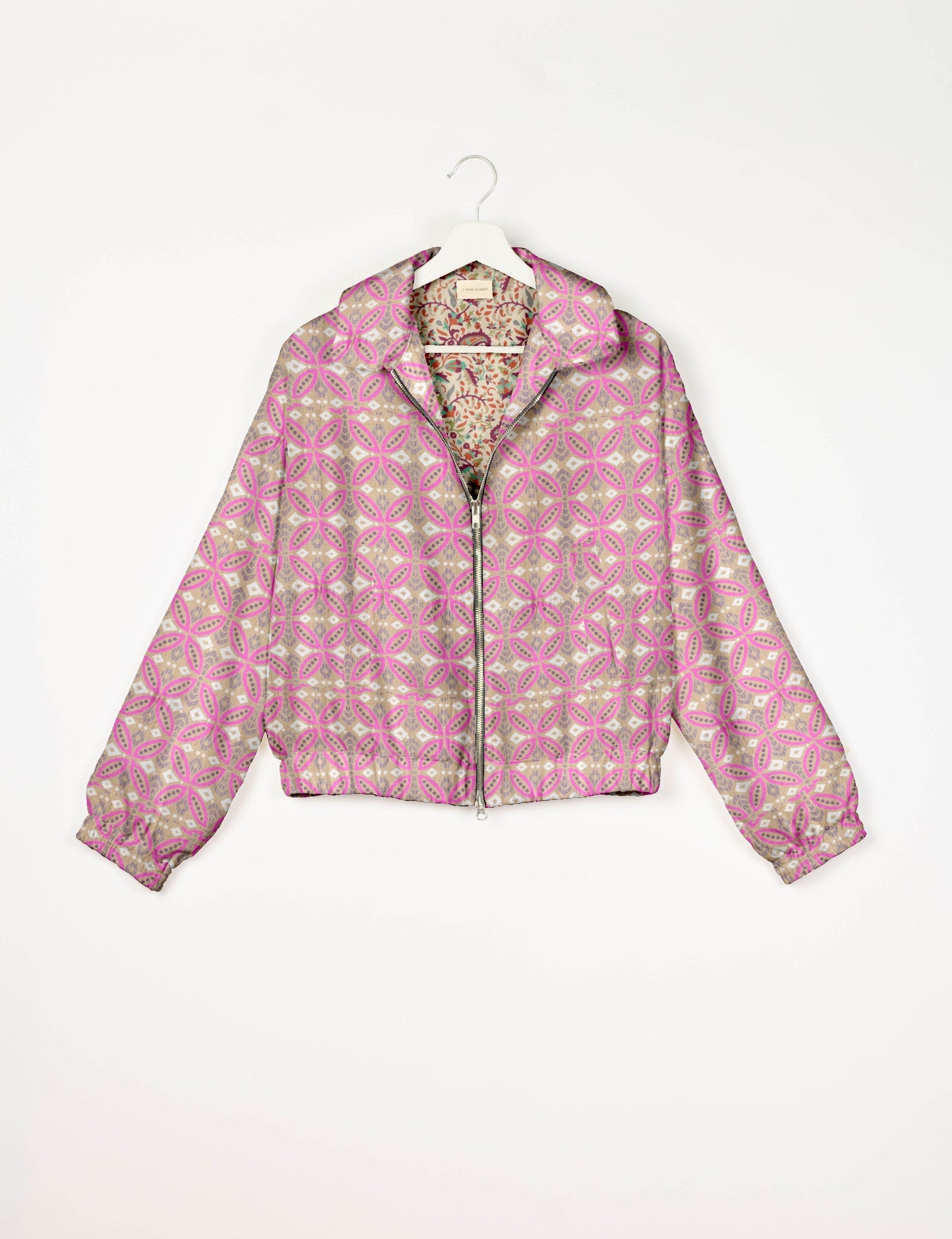 Upcycled Bomber Jacket made from recycled sari materials, featuring a cute cropped shape, elasticated hem and cuffs, and contrast sari print lining. Sustainable apparel promoting eco-friendly fashion and ethical clothing.