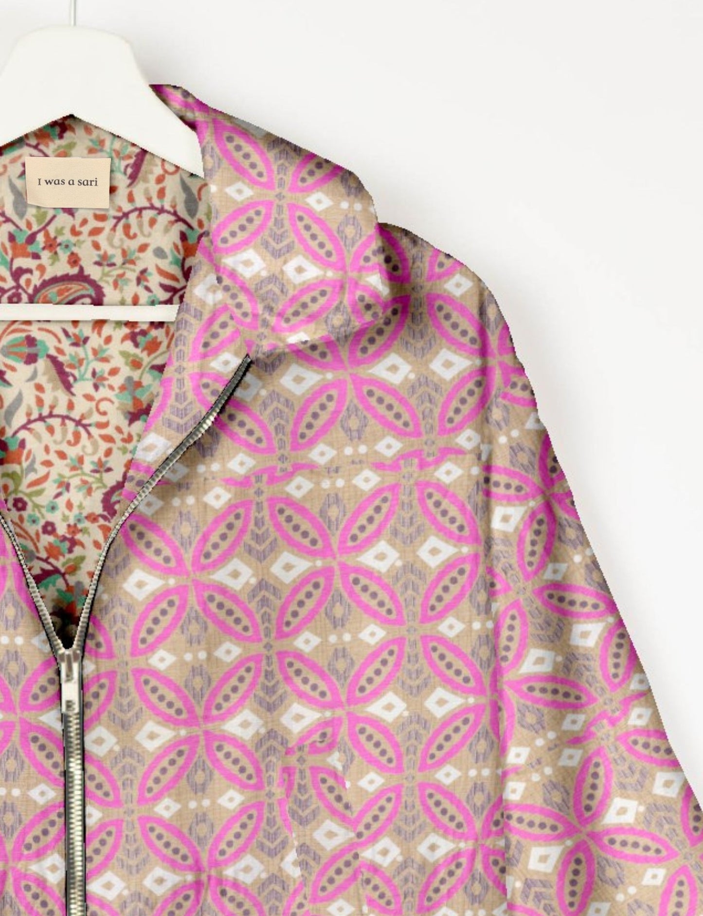 Upcycled Bomber Jacket made from recycled sari materials, featuring a cute cropped shape, elasticated hem and cuffs, and contrast sari print lining. Sustainable apparel promoting eco-friendly fashion and ethical clothing.