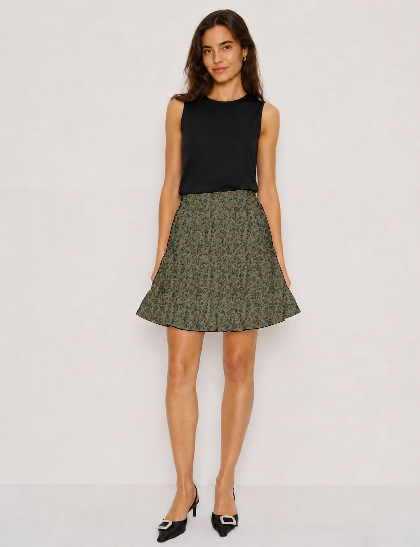 Short tiered skirt with a fitted waistband, knife pleats, softly flared silhouette, side seam pockets, and above-the-knee length.