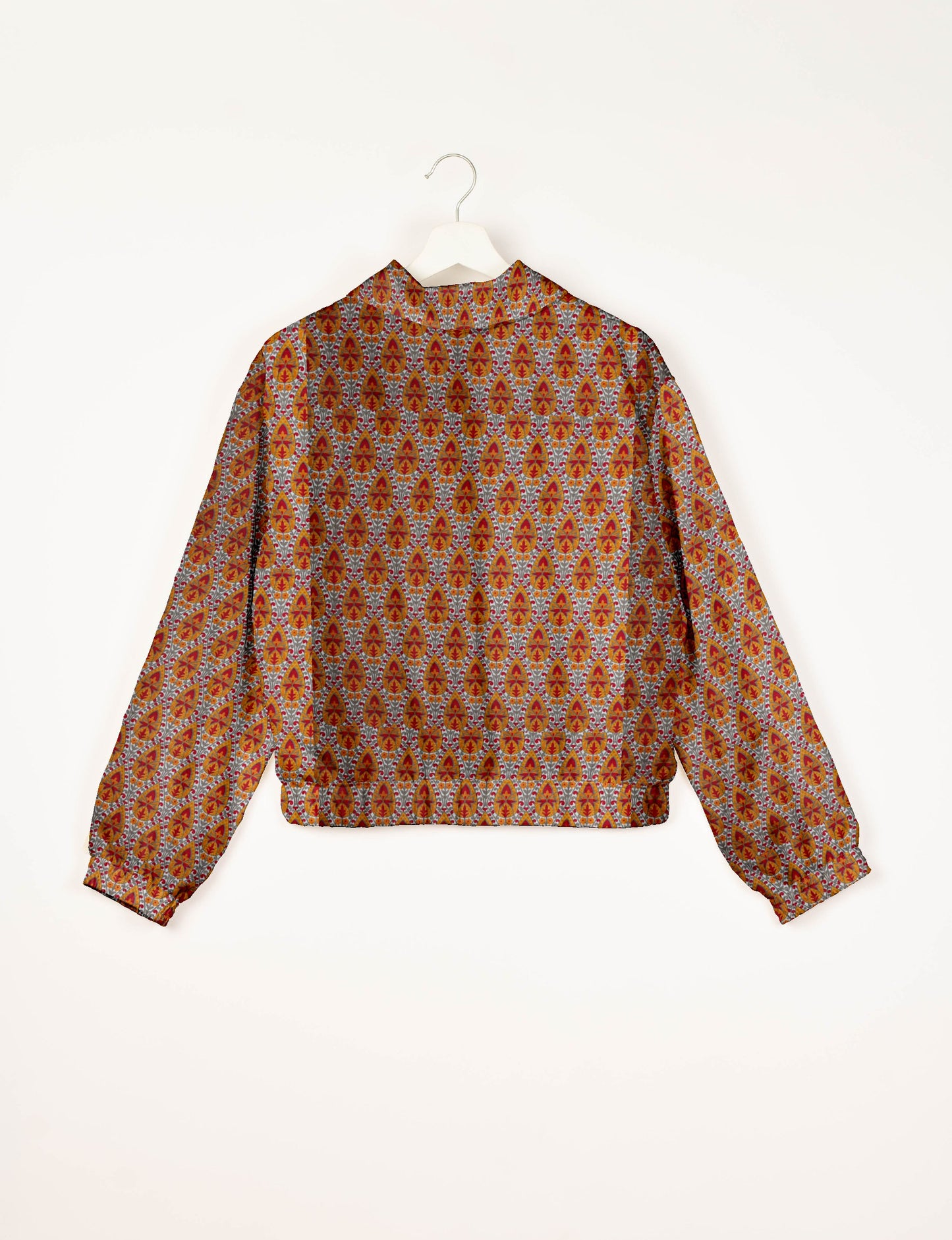 Upcycled Bomber Jacket made from recycled sari materials, featuring a cute cropped shape, elasticated hem and cuffs, and contrast sari print lining. Sustainable apparel promoting eco-friendly fashion and ethical clothing.