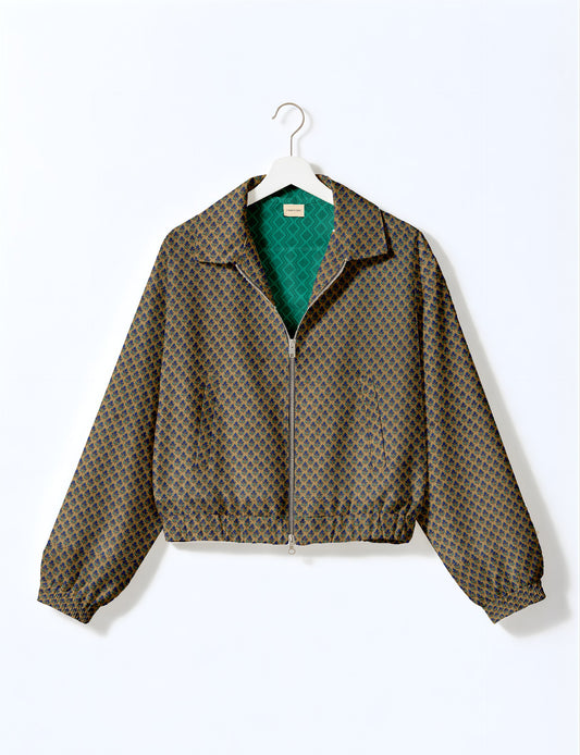 Upcycled Bomber Jacket made from recycled sari materials, featuring a cute cropped shape, elasticated hem and cuffs, and contrast sari print lining. Sustainable apparel promoting eco-friendly fashion and ethical clothing.