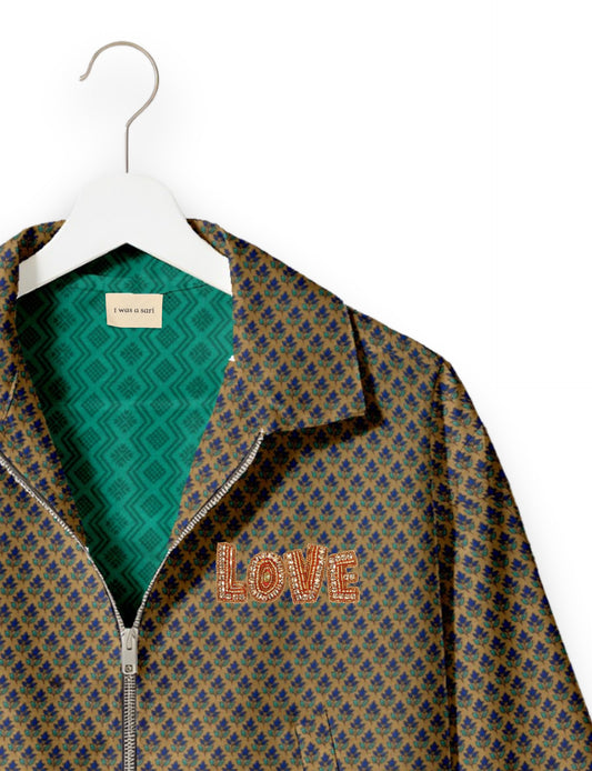 Love Bomber Jacket made from recycled fabric, featuring hand-stitched Aari embroidery. A unique piece of zero-waste clothing, part of the circular fashion movement. Designed with upcycled materials for a stylish yet environmentally friendly clothing choice.