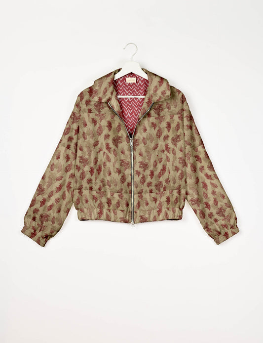 Upcycled Bomber Jacket made from recycled sari materials, featuring a cute cropped shape, elasticated hem and cuffs, and contrast sari print lining. Sustainable apparel promoting eco-friendly fashion and ethical clothing.