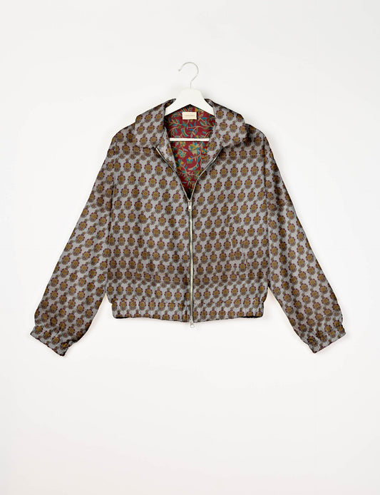 Upcycled Bomber Jacket made from recycled sari materials, featuring a cute cropped shape, elasticated hem and cuffs, and contrast sari print lining. Sustainable apparel promoting eco-friendly fashion and ethical clothing.