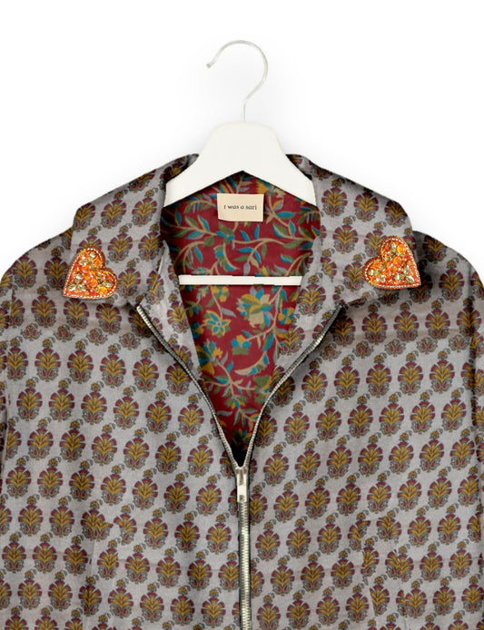 Make a bold statement with our Heart Drop Earrings, a symbol of conscious luxury and ethical fashion. Handcrafted using the intricate Aari embroidery technique, these earrings are made from upcycled sari fabric, embracing slow fashion and zero waste clothing. Elevate your look with sustainable apparel that supports fair trade fashion while reducing textile waste. Choose eco-friendly fashion that speaks of love, artistry, and responsibility.