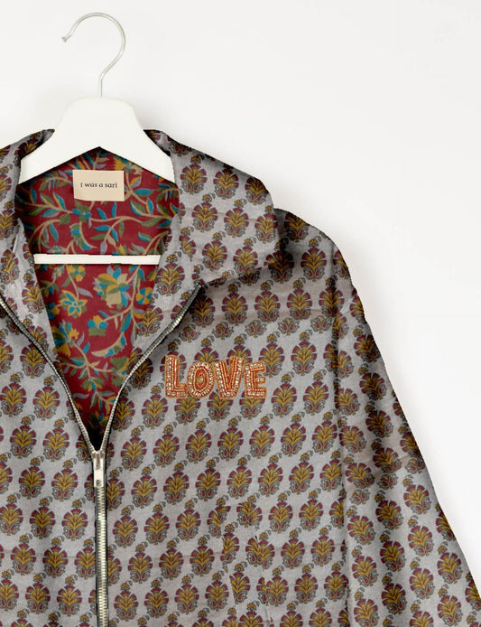Love Bomber Jacket made from recycled fabric, featuring hand-stitched Aari embroidery. A unique piece of zero-waste clothing, part of the circular fashion movement. Designed with upcycled materials for a stylish yet environmentally friendly clothing choice.