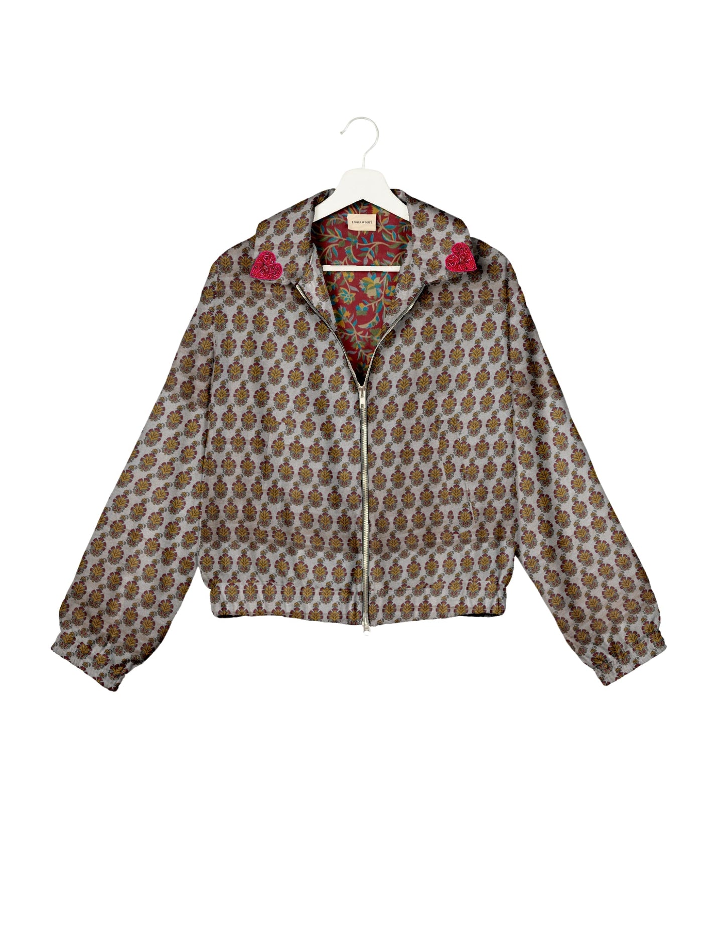 Make a bold statement with our Heart Drop Earrings, a symbol of conscious luxury and ethical fashion. Handcrafted using the intricate Aari embroidery technique, these earrings are made from upcycled sari fabric, embracing slow fashion and zero waste clothing. Elevate your look with sustainable apparel that supports fair trade fashion while reducing textile waste. Choose eco-friendly fashion that speaks of love, artistry, and responsibility.