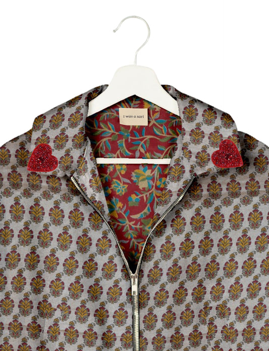 Make a bold statement with our Heart Drop Earrings, a symbol of conscious luxury and ethical fashion. Handcrafted using the intricate Aari embroidery technique, these earrings are made from upcycled sari fabric, embracing slow fashion and zero waste clothing. Elevate your look with sustainable apparel that supports fair trade fashion while reducing textile waste. Choose eco-friendly fashion that speaks of love, artistry, and responsibility.