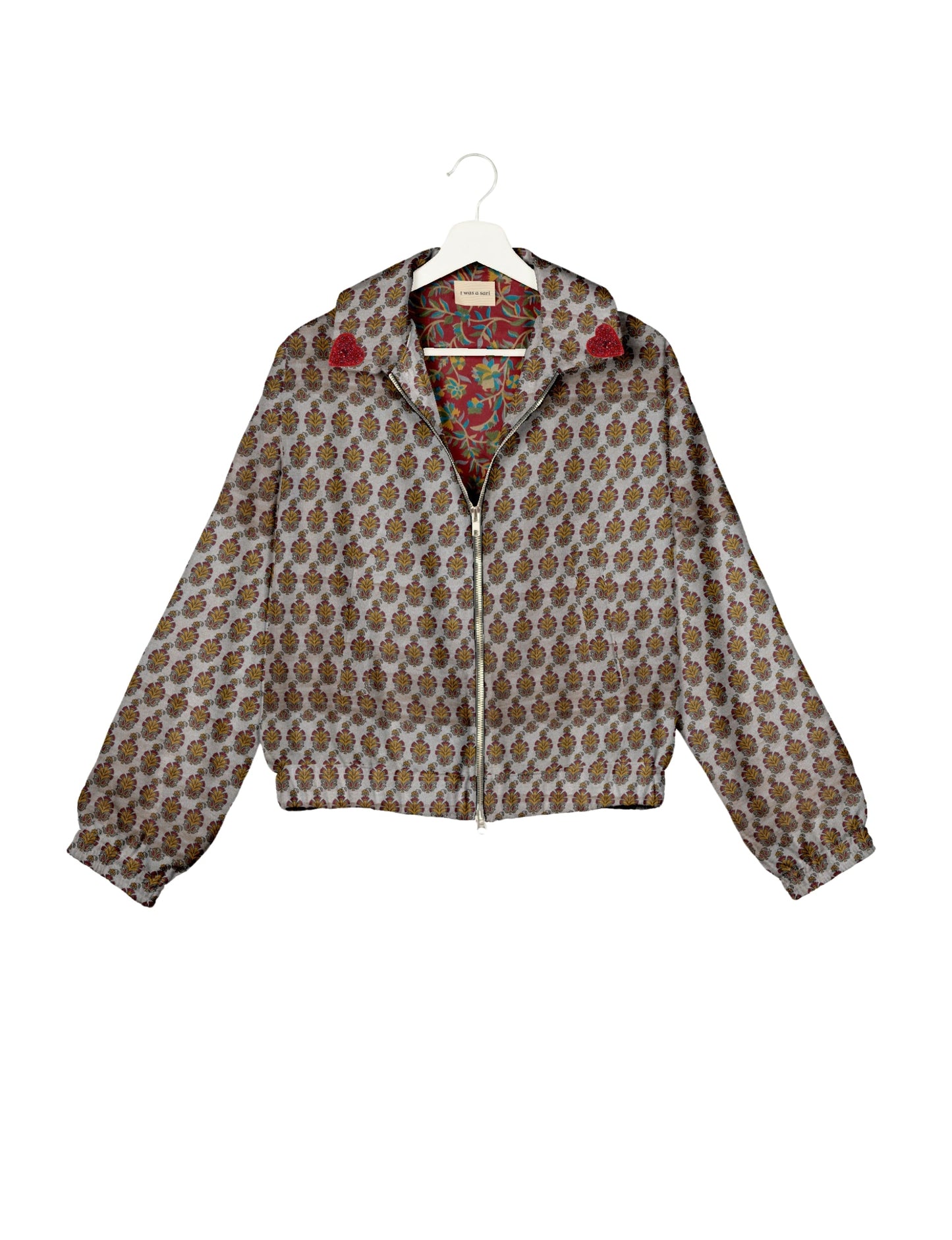 Make a bold statement with our Heart Drop Earrings, a symbol of conscious luxury and ethical fashion. Handcrafted using the intricate Aari embroidery technique, these earrings are made from upcycled sari fabric, embracing slow fashion and zero waste clothing. Elevate your look with sustainable apparel that supports fair trade fashion while reducing textile waste. Choose eco-friendly fashion that speaks of love, artistry, and responsibility.