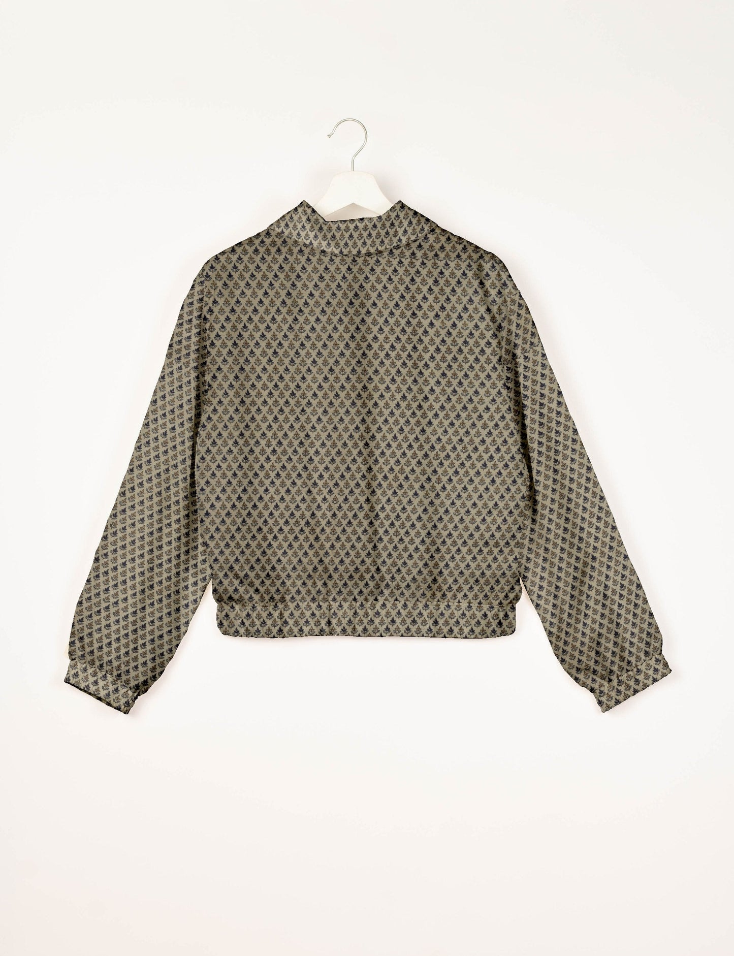 Upcycled Bomber Jacket made from recycled sari materials, featuring a cute cropped shape, elasticated hem and cuffs, and contrast sari print lining. Sustainable apparel promoting eco-friendly fashion and ethical clothing.