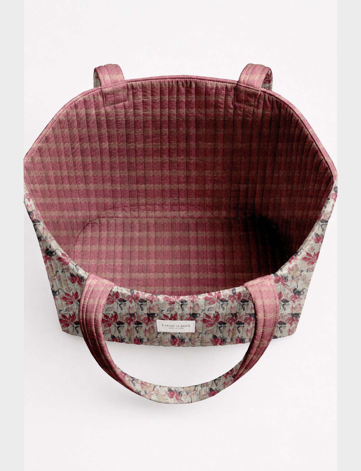 Large quilted beach bag with spacious rectangular design, reinforced shoulder straps, and open-top construction for everyday use and travel.