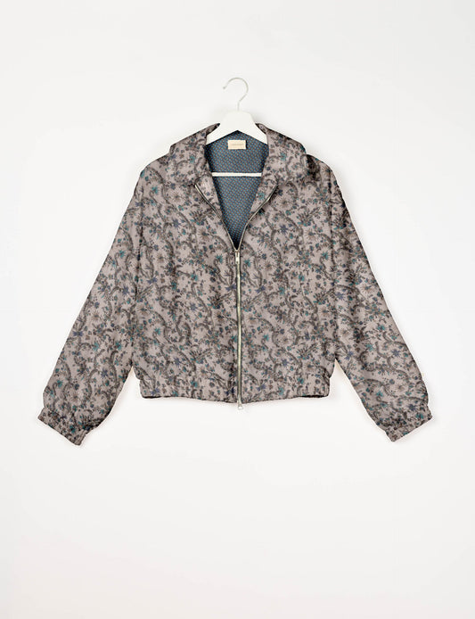 Upcycled Bomber Jacket made from recycled sari materials, featuring a cute cropped shape, elasticated hem and cuffs, and contrast sari print lining. Sustainable apparel promoting eco-friendly fashion and ethical clothing.