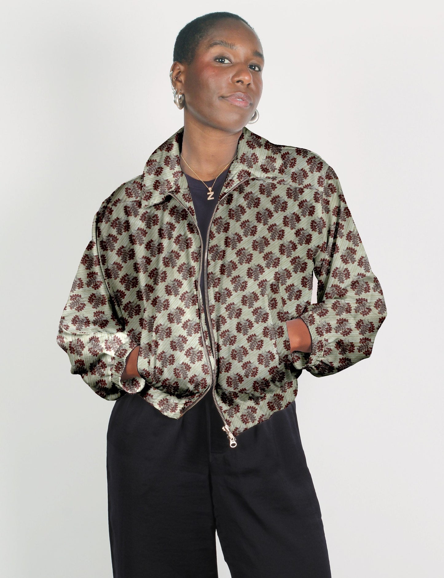 Upcycled Bomber Jacket made from recycled sari materials, featuring a cute cropped shape, elasticated hem and cuffs, and contrast sari print lining. Sustainable apparel promoting eco-friendly fashion and ethical clothing.
