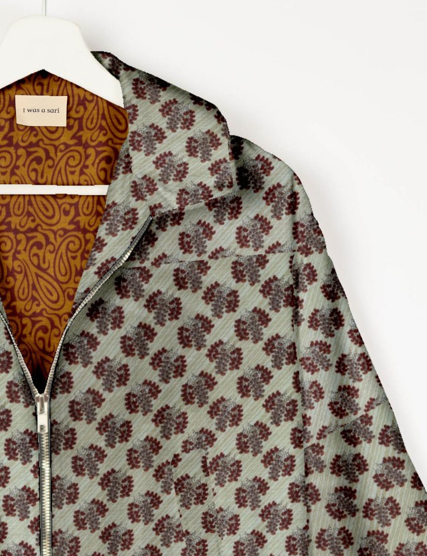 Upcycled Bomber Jacket made from recycled sari materials, featuring a cute cropped shape, elasticated hem and cuffs, and contrast sari print lining. Sustainable apparel promoting eco-friendly fashion and ethical clothing.