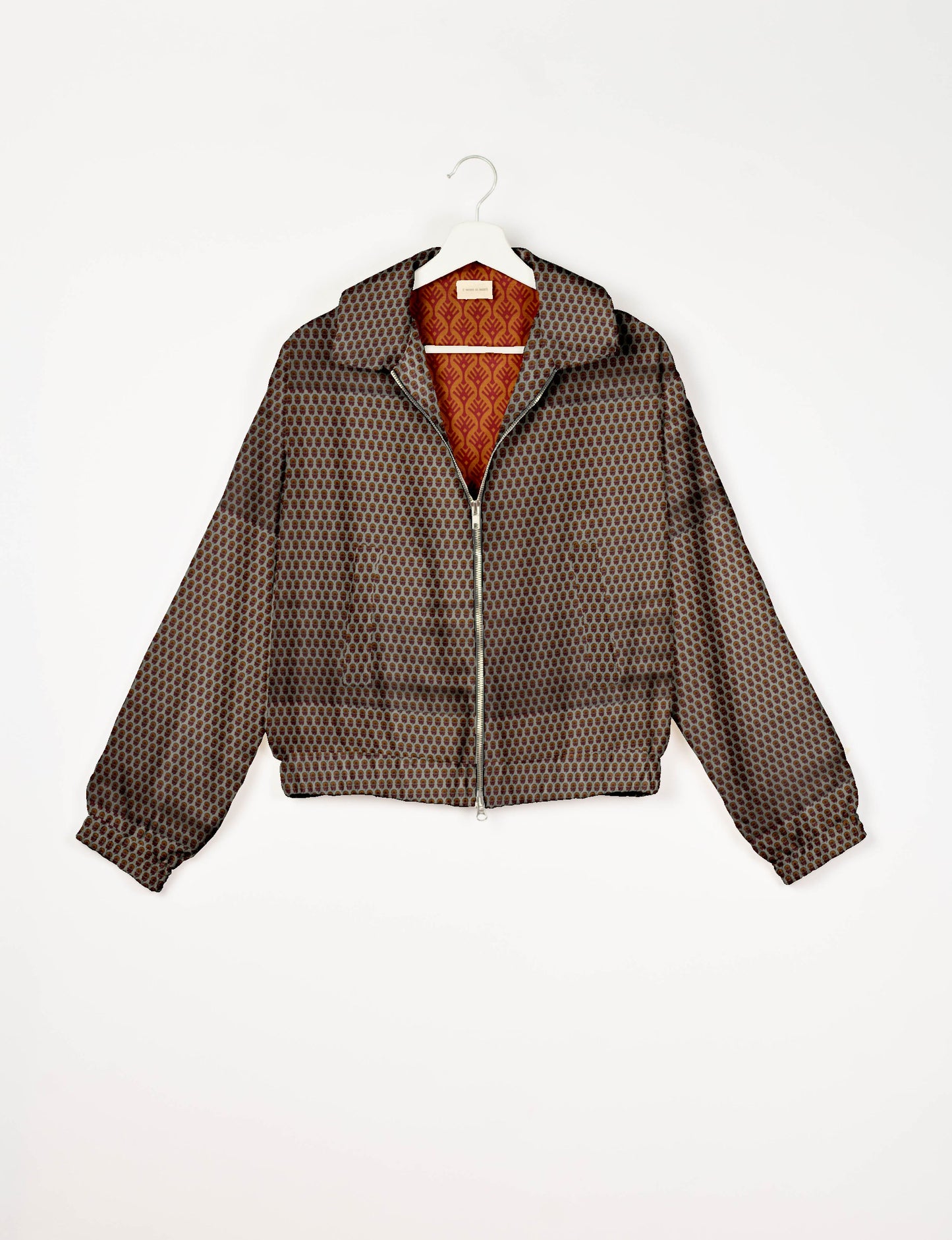 Upcycled Bomber Jacket made from recycled sari materials, featuring a cute cropped shape, elasticated hem and cuffs, and contrast sari print lining. Sustainable apparel promoting eco-friendly fashion and ethical clothing.