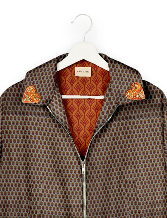 Make a bold statement with our Heart Drop Earrings, a symbol of conscious luxury and ethical fashion. Handcrafted using the intricate Aari embroidery technique, these earrings are made from upcycled sari fabric, embracing slow fashion and zero waste clothing. Elevate your look with sustainable apparel that supports fair trade fashion while reducing textile waste. Choose eco-friendly fashion that speaks of love, artistry, and responsibility.