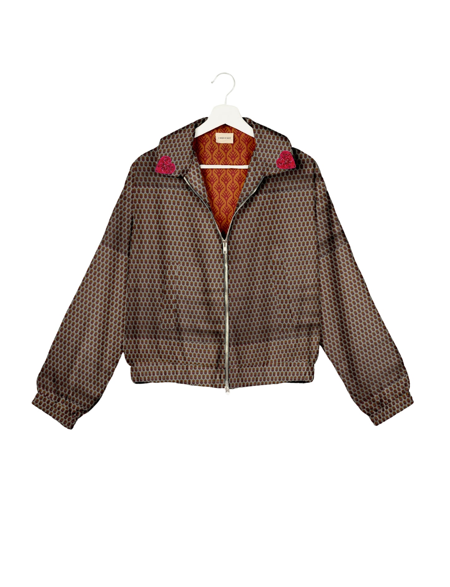 Make a bold statement with our Heart Drop Earrings, a symbol of conscious luxury and ethical fashion. Handcrafted using the intricate Aari embroidery technique, these earrings are made from upcycled sari fabric, embracing slow fashion and zero waste clothing. Elevate your look with sustainable apparel that supports fair trade fashion while reducing textile waste. Choose eco-friendly fashion that speaks of love, artistry, and responsibility.