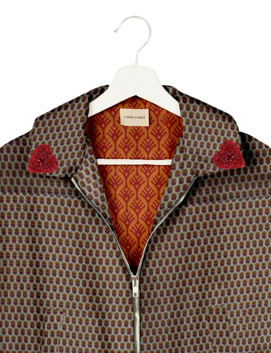 Make a bold statement with our Heart Drop Earrings, a symbol of conscious luxury and ethical fashion. Handcrafted using the intricate Aari embroidery technique, these earrings are made from upcycled sari fabric, embracing slow fashion and zero waste clothing. Elevate your look with sustainable apparel that supports fair trade fashion while reducing textile waste. Choose eco-friendly fashion that speaks of love, artistry, and responsibility.