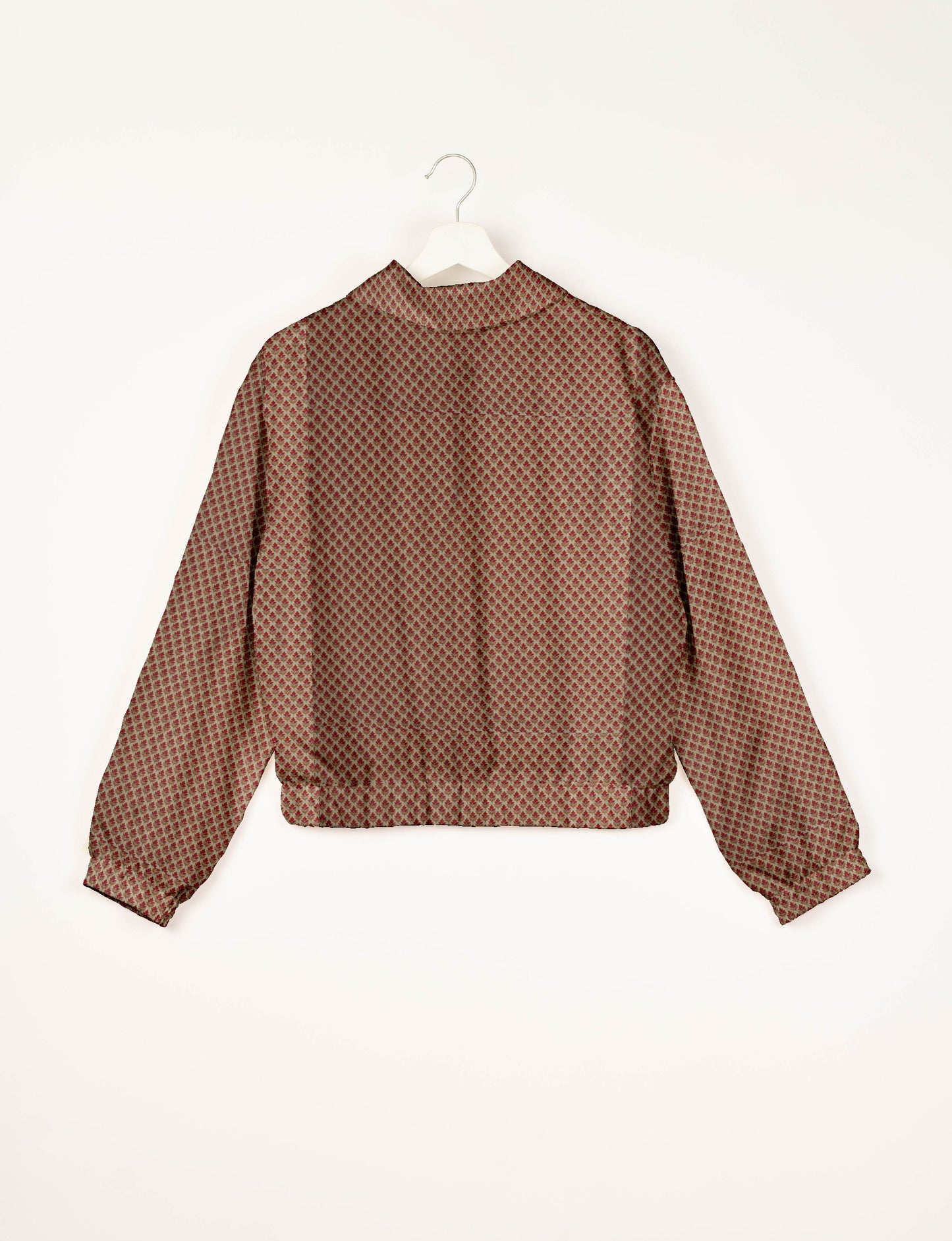 Upcycled Bomber Jacket made from recycled sari materials, featuring a cute cropped shape, elasticated hem and cuffs, and contrast sari print lining. Sustainable apparel promoting eco-friendly fashion and ethical clothing.