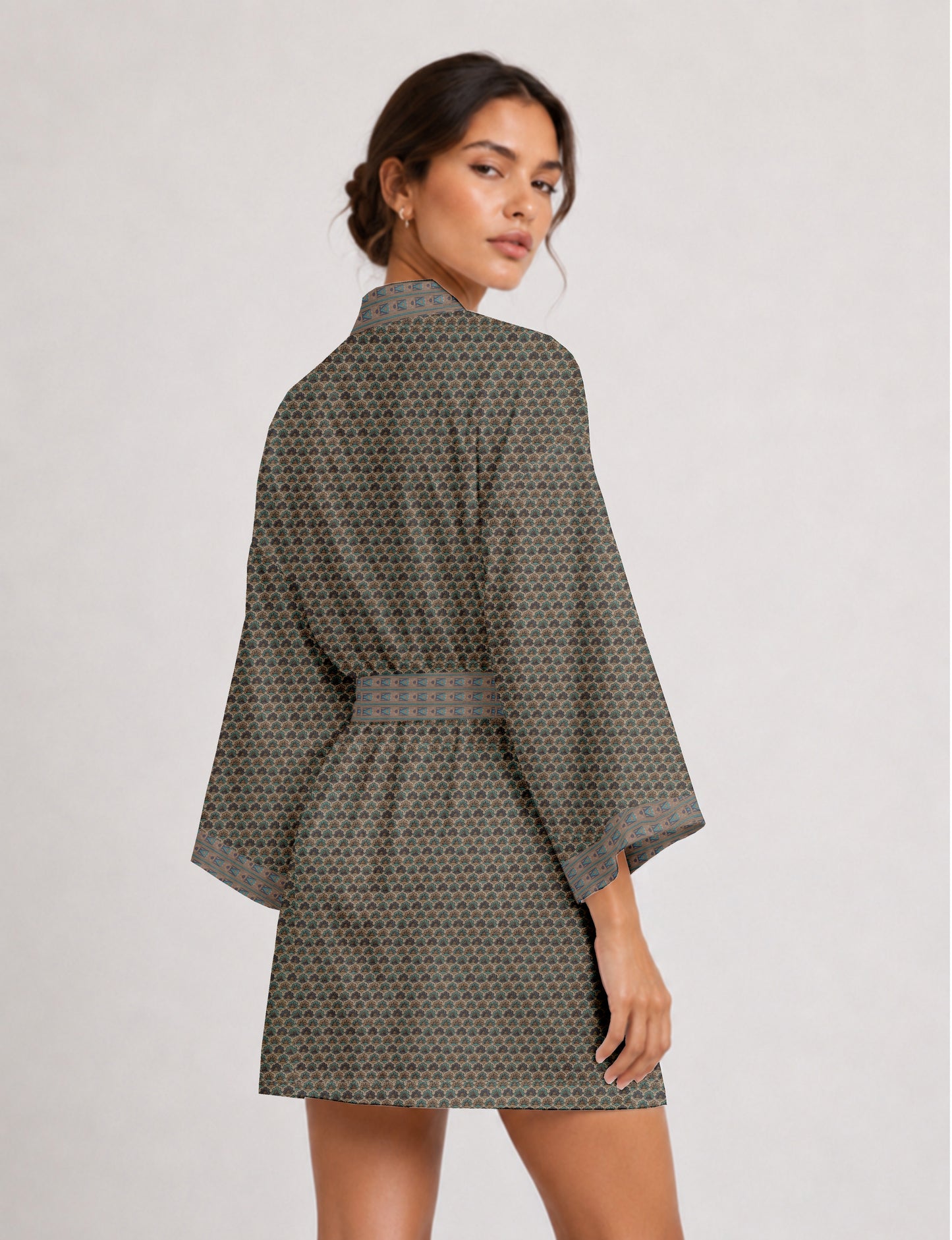 Short kimono robe with wrap front, V-neckline, wide sleeves, waist tie, and concealed skort detail.