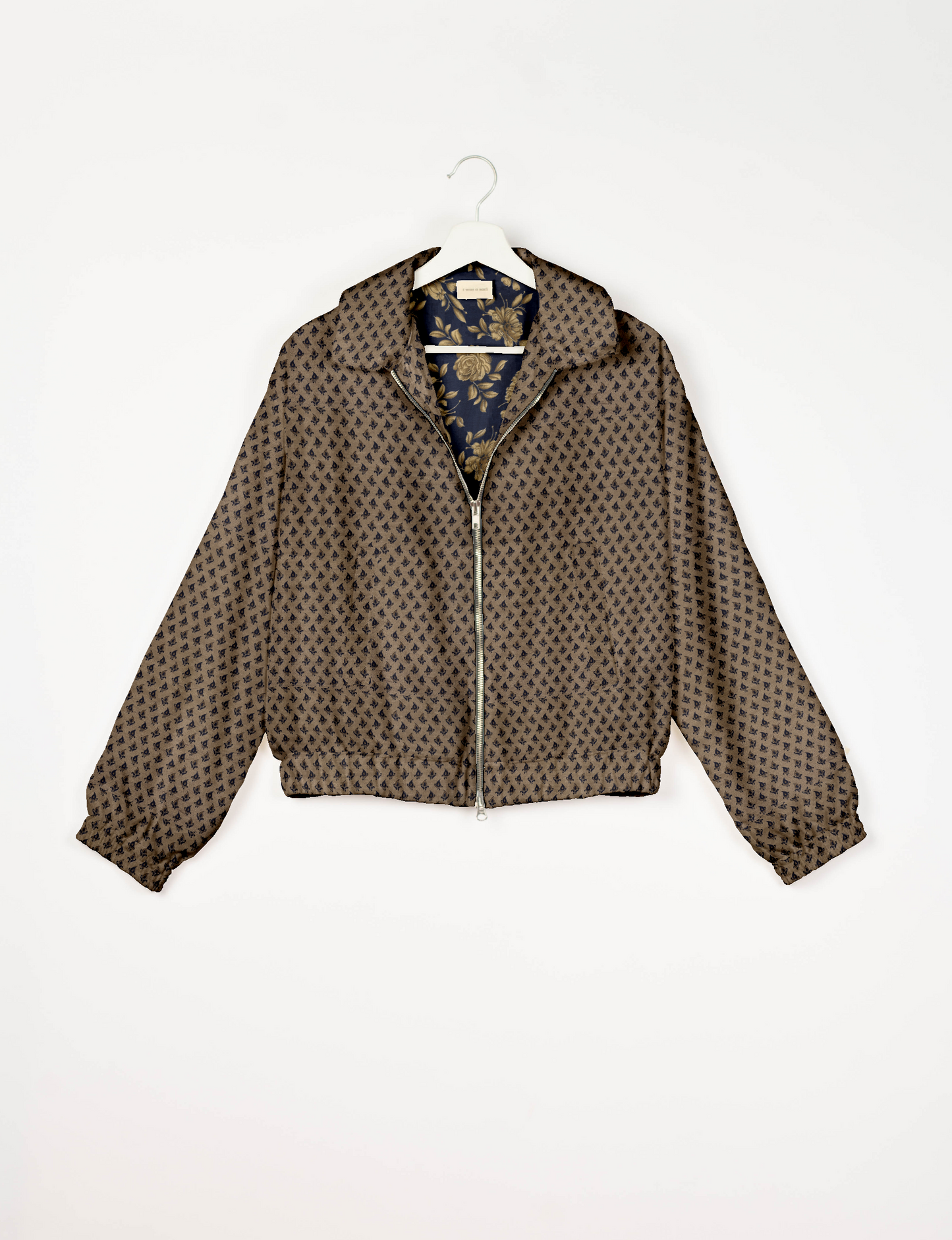 Upcycled Bomber Jacket made from recycled sari materials, featuring a cute cropped shape, elasticated hem and cuffs, and contrast sari print lining. Sustainable apparel promoting eco-friendly fashion and ethical clothing.