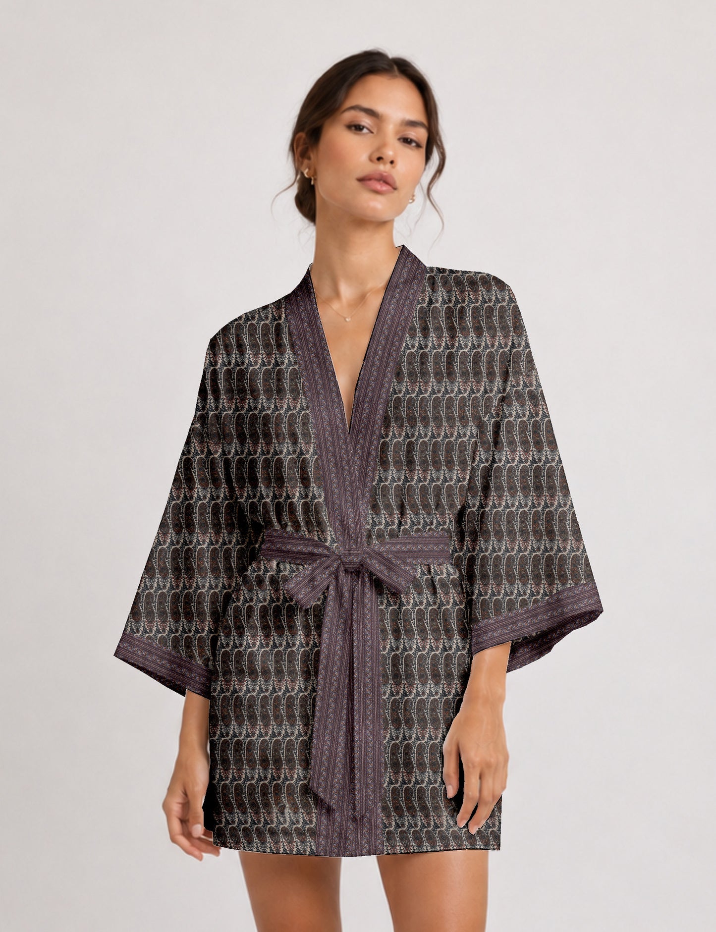 Short kimono robe with wrap front, V-neckline, wide sleeves, waist tie, and concealed skort detail.