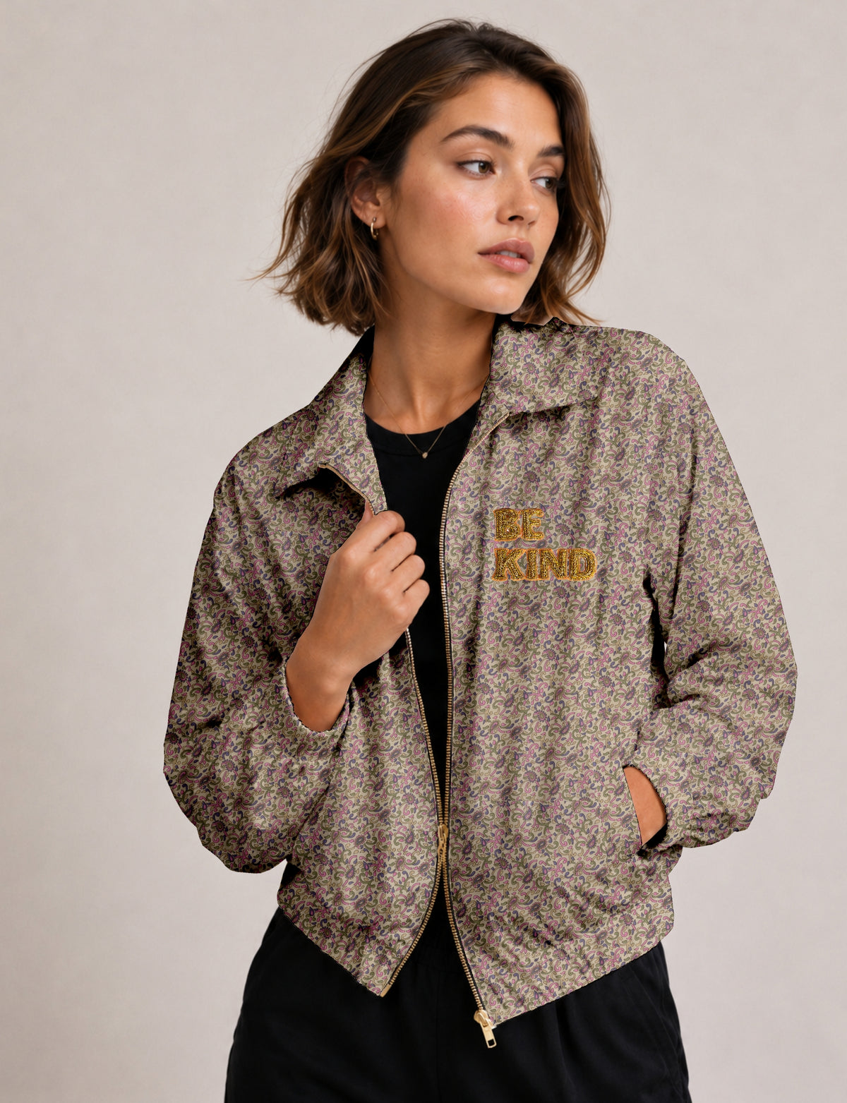 BE KIND Bomber jacket made from upcycled sari fabric with handcrafted Aari embroidery by female artisans.