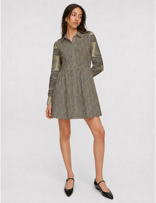 Short shirt dress with a relaxed A-line silhouette, point collar, partial button placket, gathered waist, side pockets, and full-length cuffed sleeves.