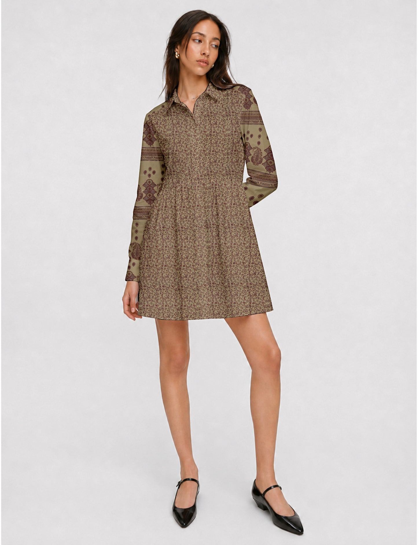Short shirt dress with a relaxed A-line silhouette, point collar, partial button placket, gathered waist, side pockets, and full-length cuffed sleeves.