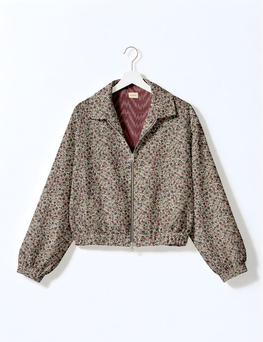 Upcycled Bomber Jacket made from recycled sari materials, featuring a cute cropped shape, elasticated hem and cuffs, and contrast sari print lining. Sustainable apparel promoting eco-friendly fashion and ethical clothing.