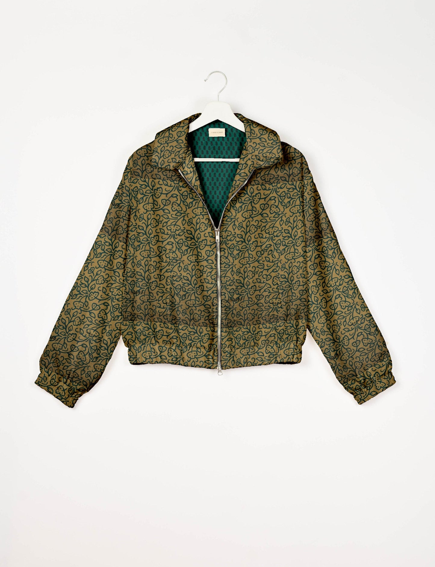 Upcycled Bomber Jacket made from recycled sari materials, featuring a cute cropped shape, elasticated hem and cuffs, and contrast sari print lining. Sustainable apparel promoting eco-friendly fashion and ethical clothing.