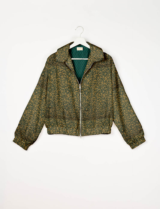 Upcycled Bomber Jacket made from recycled sari materials, featuring a cute cropped shape, elasticated hem and cuffs, and contrast sari print lining. Sustainable apparel promoting eco-friendly fashion and ethical clothing.