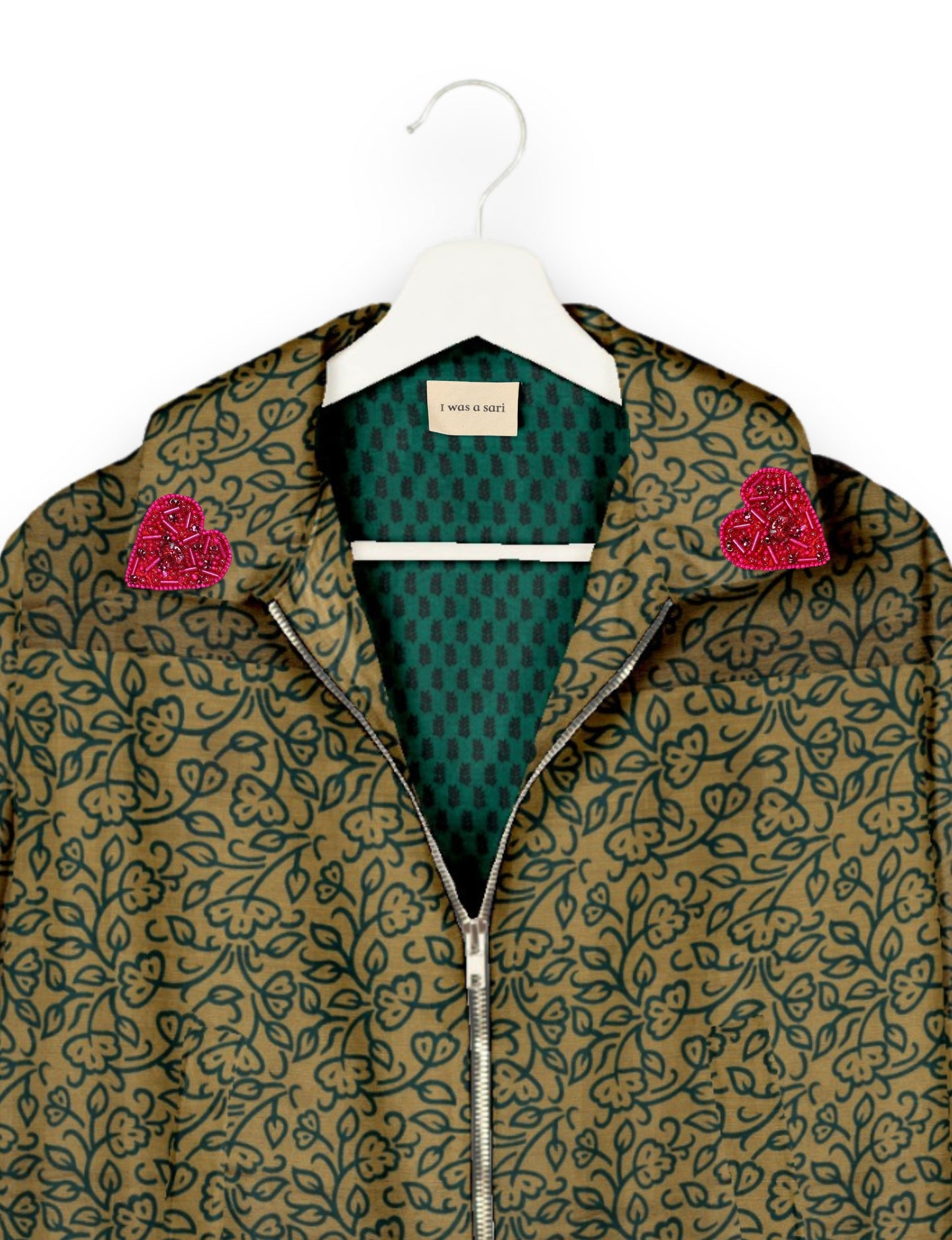 Make a bold statement with our Heart Drop Earrings, a symbol of conscious luxury and ethical fashion. Handcrafted using the intricate Aari embroidery technique, these earrings are made from upcycled sari fabric, embracing slow fashion and zero waste clothing. Elevate your look with sustainable apparel that supports fair trade fashion while reducing textile waste. Choose eco-friendly fashion that speaks of love, artistry, and responsibility.