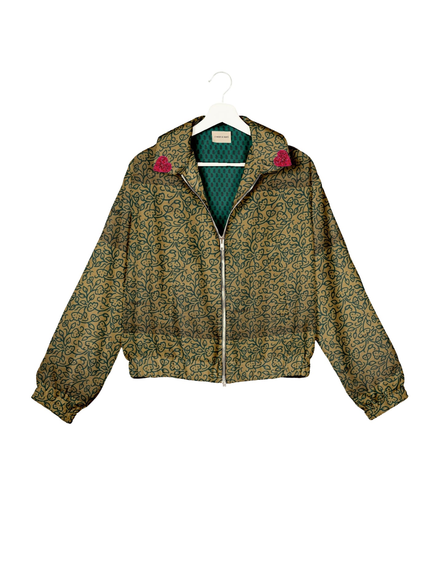 Make a bold statement with our Heart Drop Earrings, a symbol of conscious luxury and ethical fashion. Handcrafted using the intricate Aari embroidery technique, these earrings are made from upcycled sari fabric, embracing slow fashion and zero waste clothing. Elevate your look with sustainable apparel that supports fair trade fashion while reducing textile waste. Choose eco-friendly fashion that speaks of love, artistry, and responsibility.