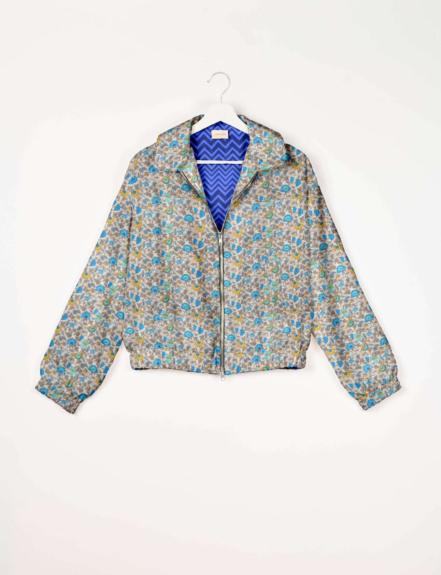Upcycled Bomber Jacket made from recycled sari materials, featuring a cute cropped shape, elasticated hem and cuffs, and contrast sari print lining. Sustainable apparel promoting eco-friendly fashion and ethical clothing.