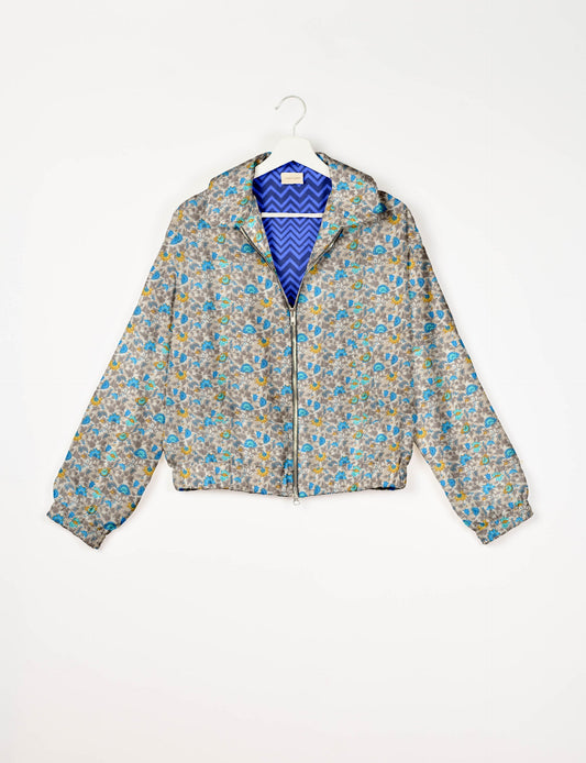 Upcycled Bomber Jacket made from recycled sari materials, featuring a cute cropped shape, elasticated hem and cuffs, and contrast sari print lining. Sustainable apparel promoting eco-friendly fashion and ethical clothing.